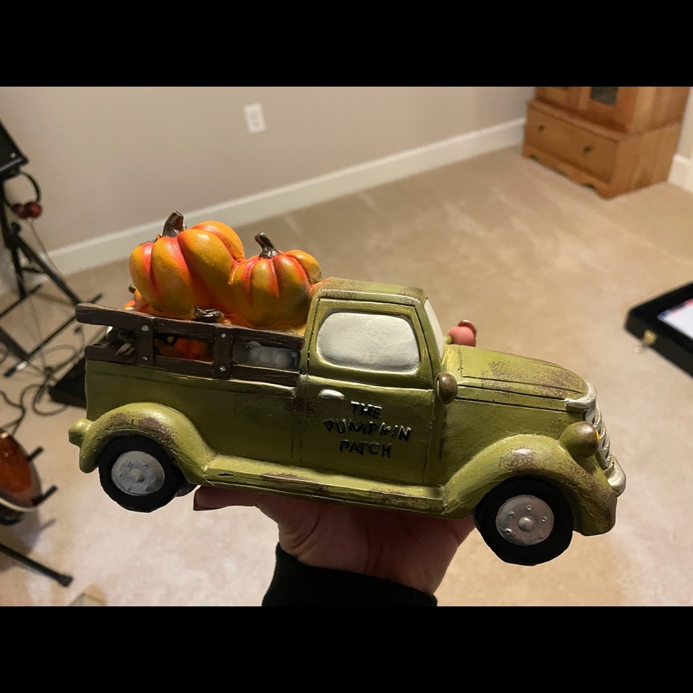 A pumpkin patch green truck